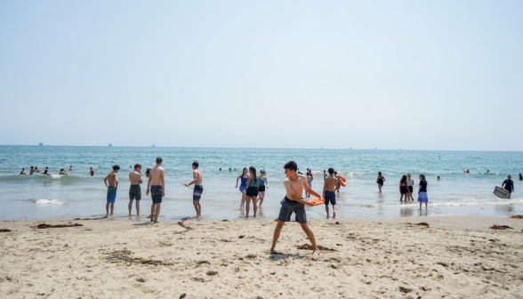 A student winds up for a Frisbee throw