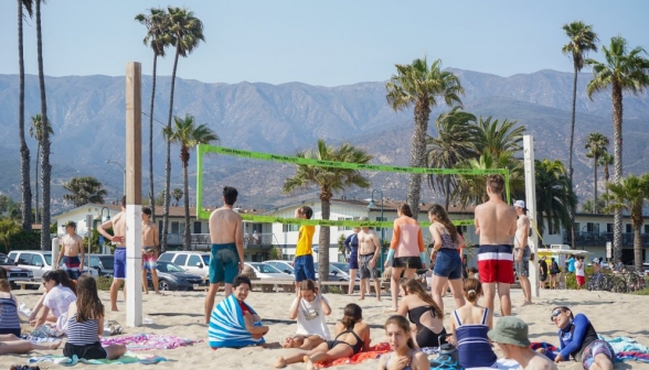 The volleyball game develops an audience
