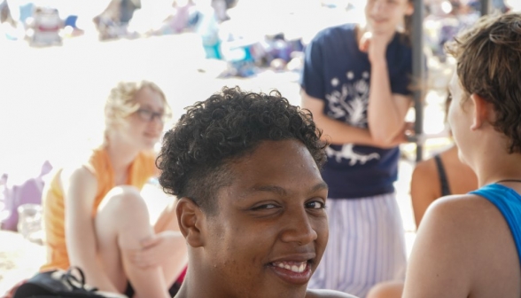 A student smiles for the camera
