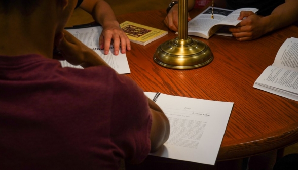 Closeup of a a student's text of Fabre on the table