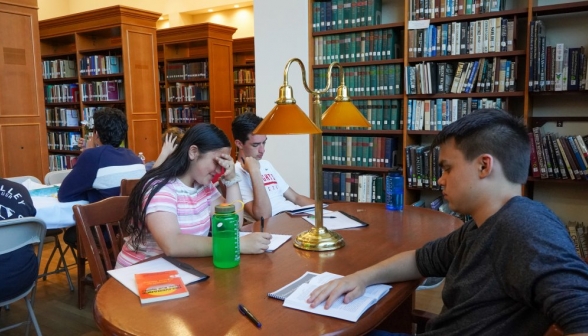 A table of three behind the main stacks
