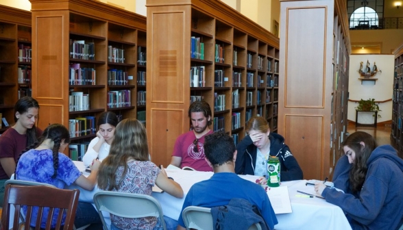 Another folding table full of students