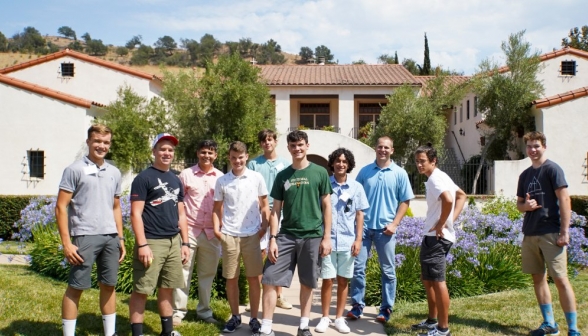 Ten HSSP students pose afront their residence hall