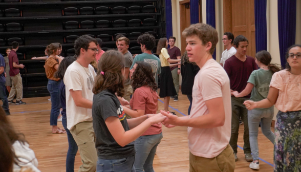 Two students assume the swing position