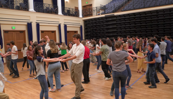 Wide shot of the students all practicing their learned moves