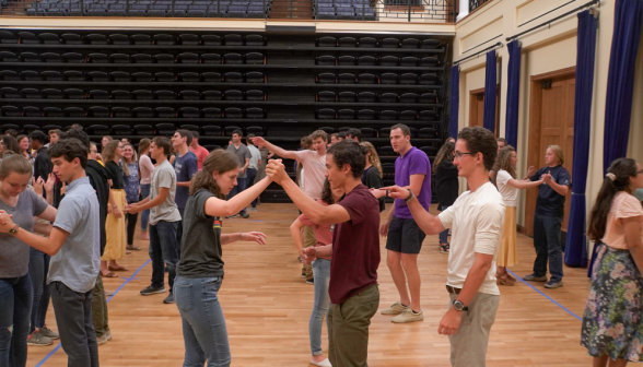 Students perform a waltz turn