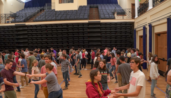 A view of almost the entire dancefloor, covered in students practicing their moves