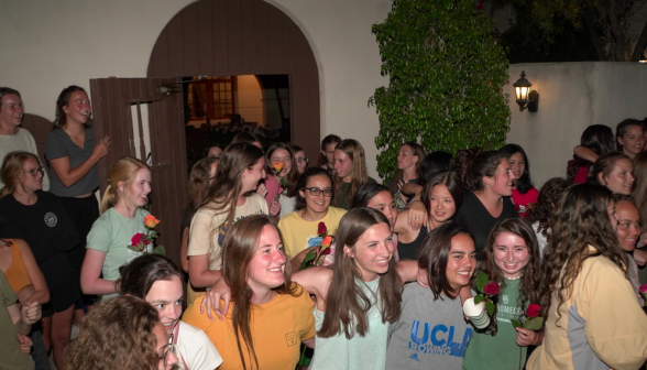 The girls at the door watching the singing take place