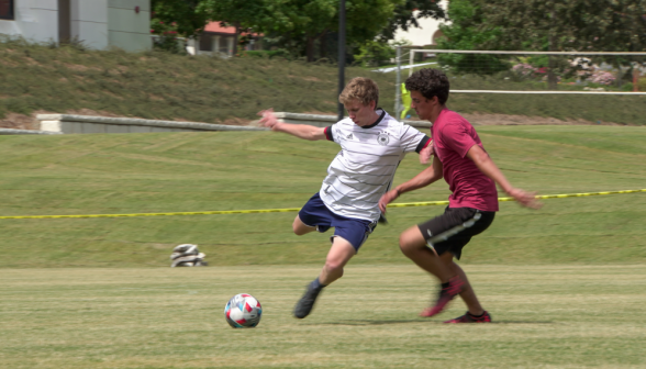 Another student in full wind-up for a long-range kick