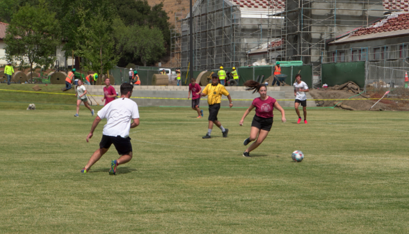 A prefect dashes in and gains control of the ball!