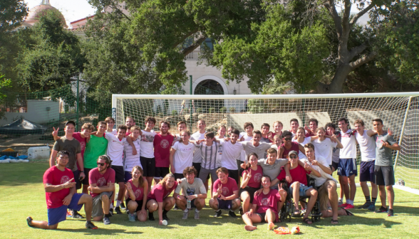 Students and prefects pose for a group photo afront one of the goals