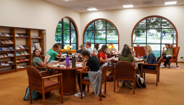 The students in the library's left wing, filling the tables