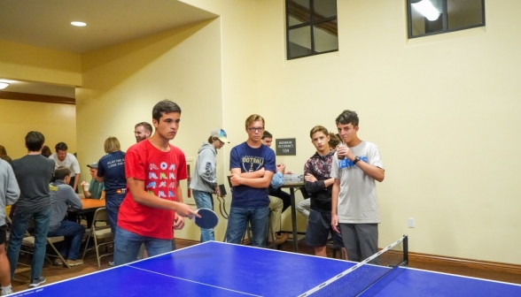 All serious faces as a ping-pong match goes down to the wire