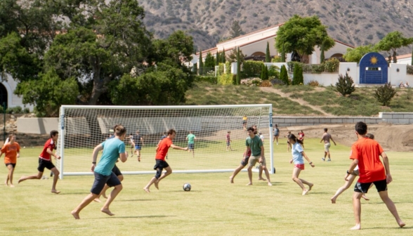 The soccer game intensifies as the ball nears a goal