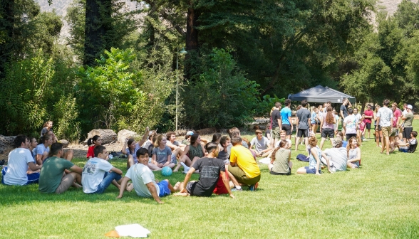 A ring of students, seated