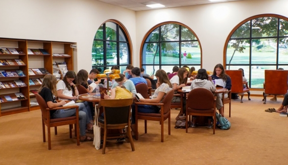 A group of study tables in the library's left wing