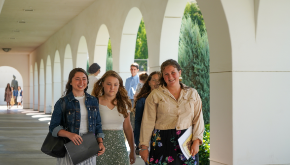 Students walk along academic quadrangle