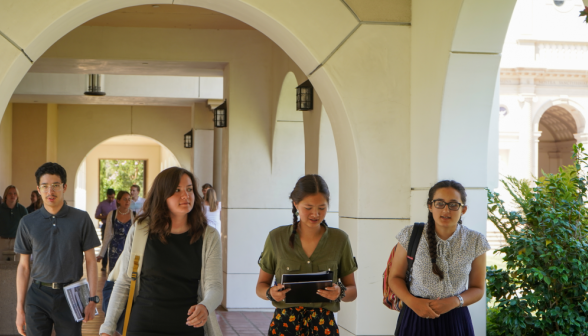 Students walk along academic quadrangle