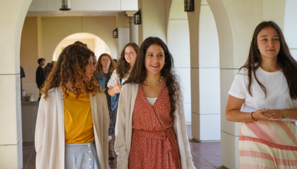 Students walk along academic quadrangle