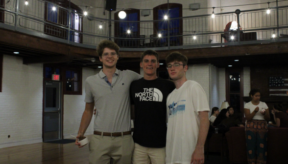 Three students pose for a photo