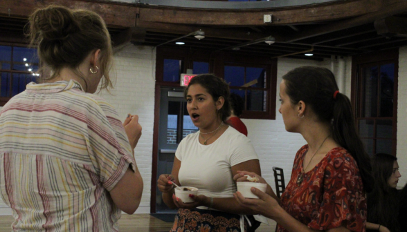 Three students chatting over their icecream