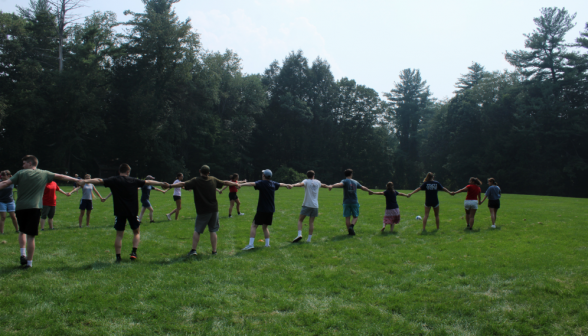 Students join hands and form a long line