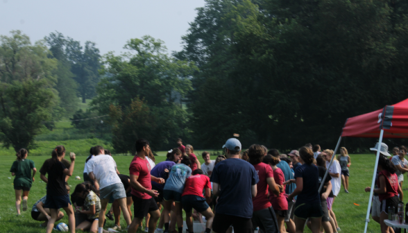 All the summer programmers, crowded around a pail of water balloons