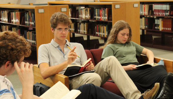 Students study on the library couches