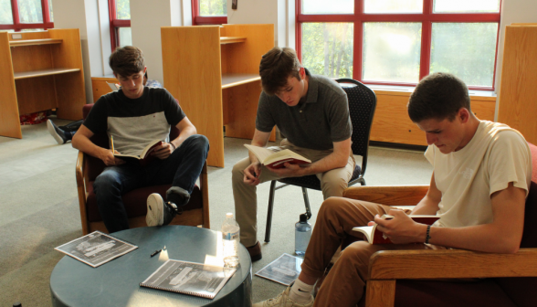 Three study in chairs around a low round table