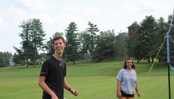 Two students afront the volleyball net