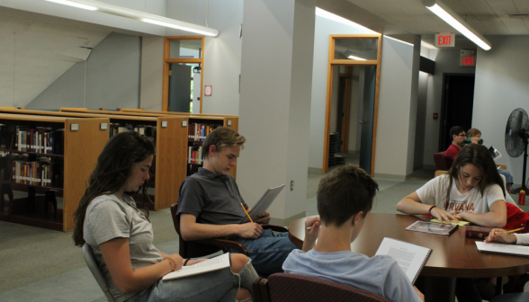 Closeup of the students on one side of a study table on the main floor