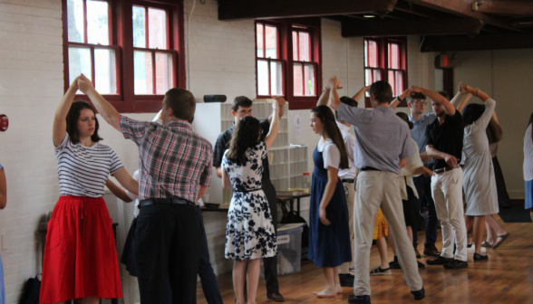 Students practice their first dance "turn"