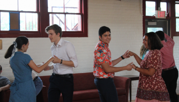 Two student dance couples practicing their moves