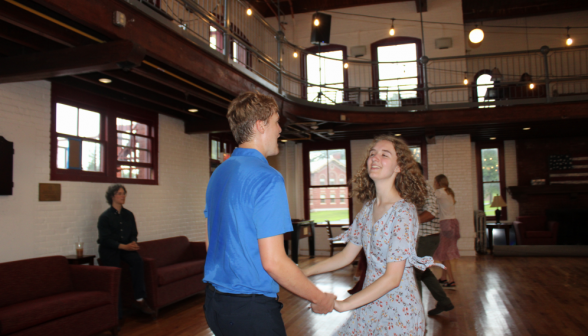 A pair of students dancing