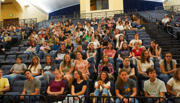 Students wave from their seats