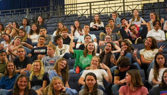 Students wave from their seats