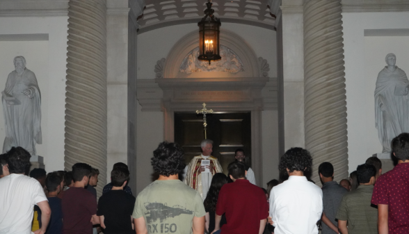 Students pray the Stations of the Cross