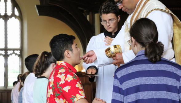 Fr. Miguel gives Communion at the rail