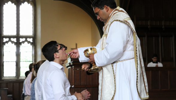 Fr. Miguel gives a prefect Communion
