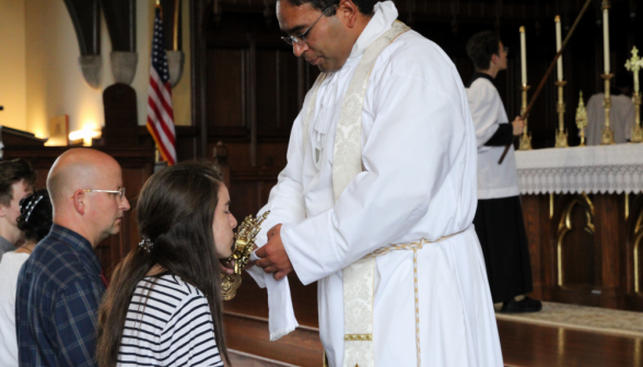 Venerating the relic at the railing