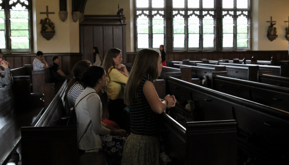 A row of students in a pew