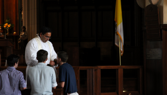 Fr. Miguel offering a relic for veneration