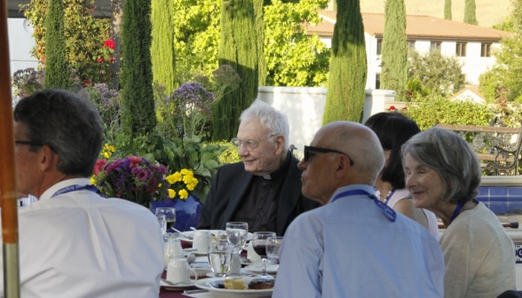 A table of attendees with Fr. Buckley