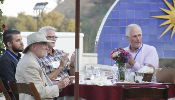 Close-up shot of one table applauding