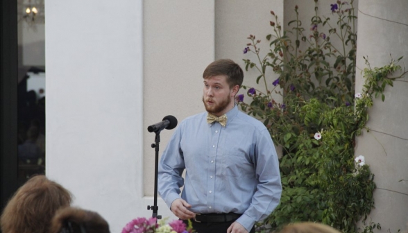 A student sings for the assembly