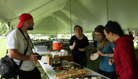 Students admire a cheese board with crackers