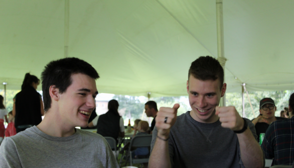 Another two students laughing together over a joke