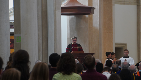 Dr. Seeley does one of the readings at the pulpit