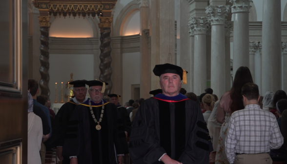 The tutors exit their pews and join the recession