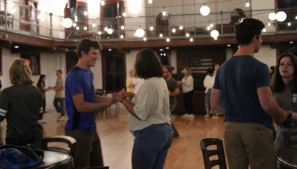 Students pair up to dance